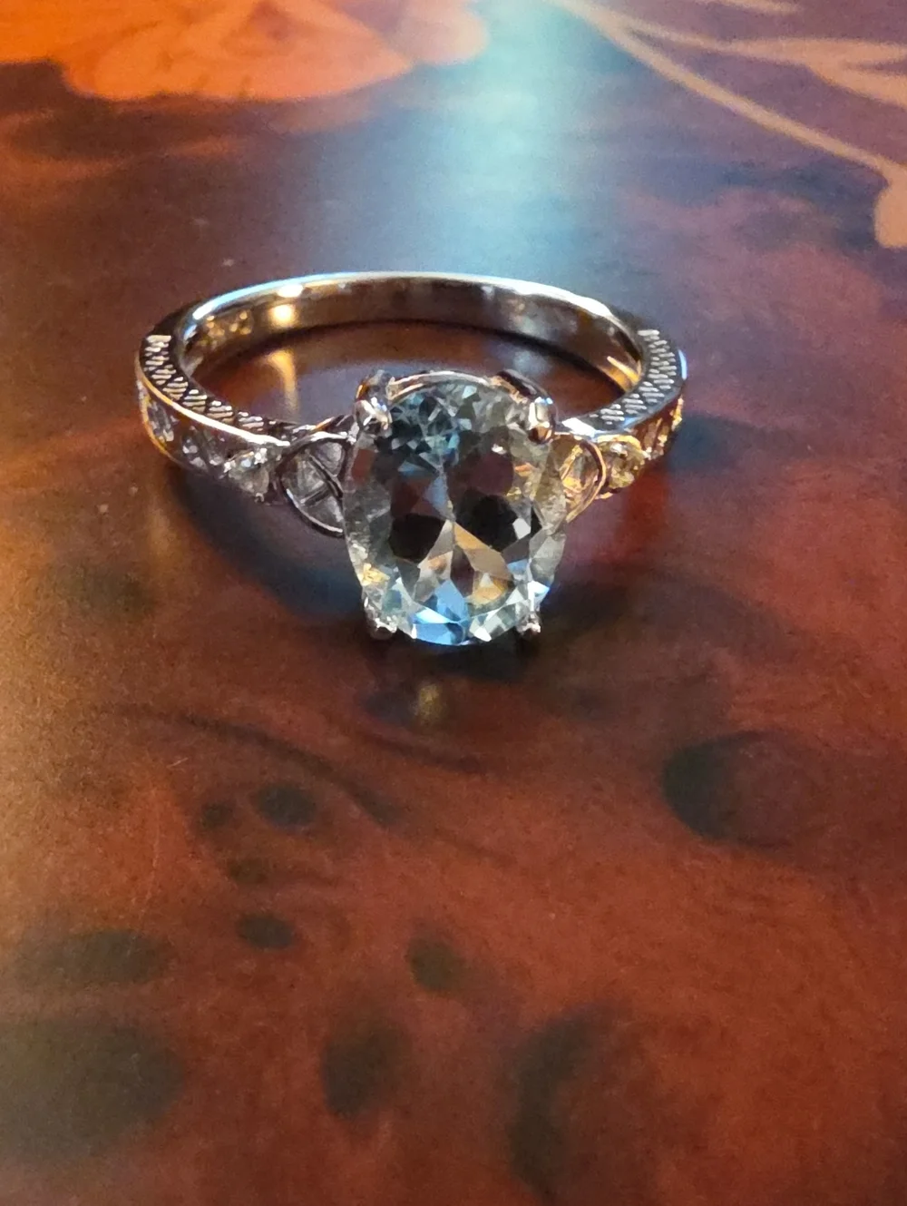 JTV Oval Glacier Topaz(TM) With White Topaz Rhodium Over Silver Ring